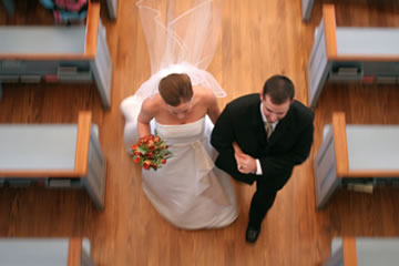 Bride and Groom walking down the aisle